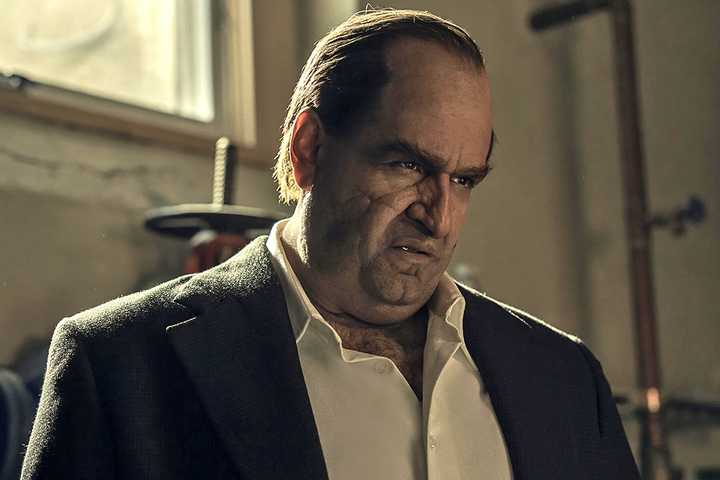 Colin Farrell as Oz 'The Penguin' Cobb sneering down at someone in The Penguin.