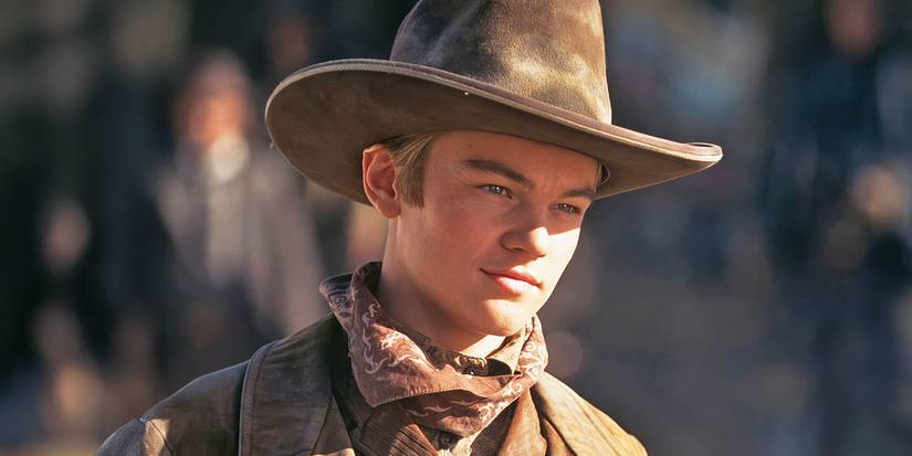 Leonardo DiCaprio smiling as The Kid in the Western movie, The Quick and the Dead.