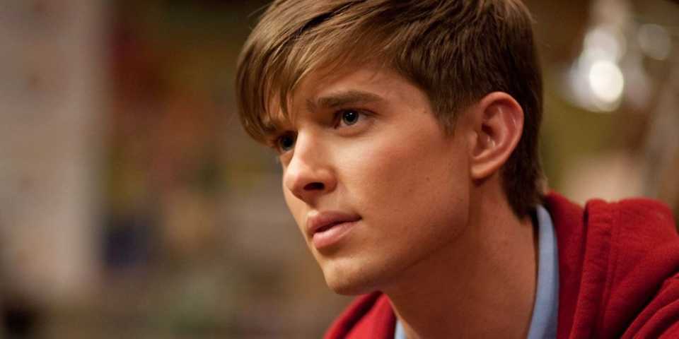 Drew Van Acker as Ian staring intently off-camera in Tower Prep.