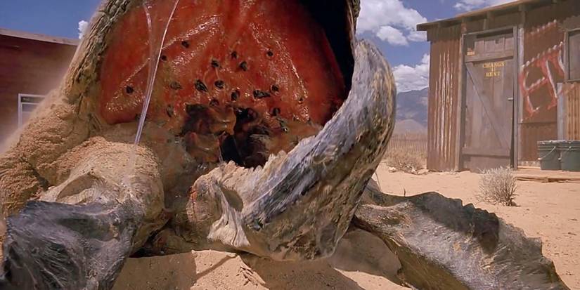 A big monster bursting out of the ground in the desert, in the first Tremors movie