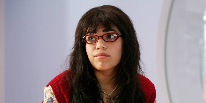 America Ferrera as Betty wearing glasses and looking sad in Ugly Betty.
