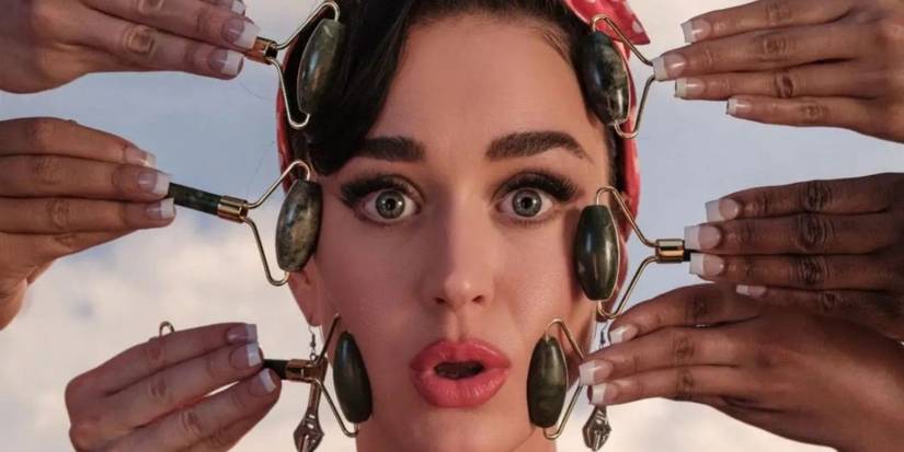 Katy Perry getting her face massaged with jade rollers by 6 different hands for Woman's World music video