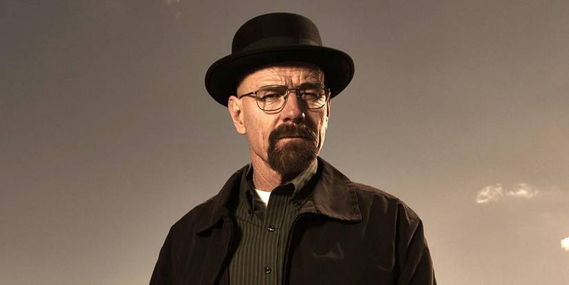 Bryan Cranston as Walter White wearing a hat and frowning with a plain sky behind in Breaking Bad.