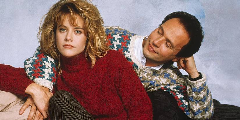 Billy Crystal looking at Meg Ryan who is looking at the camera in When Harry Met Sally.