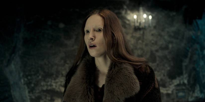 a red-headed girl looks towards the camera in 'Cracow Monsters.'