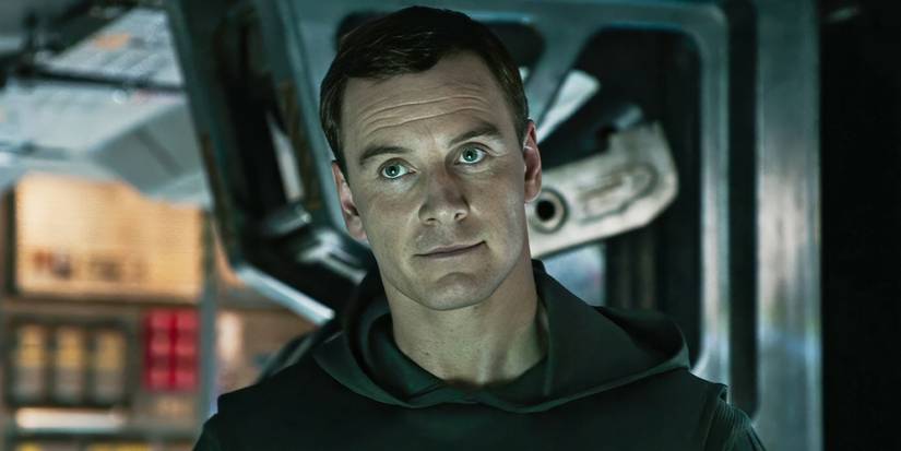 Michael Fassbender smiles slightly aboard a spacecraft in 'Alien Covenant'