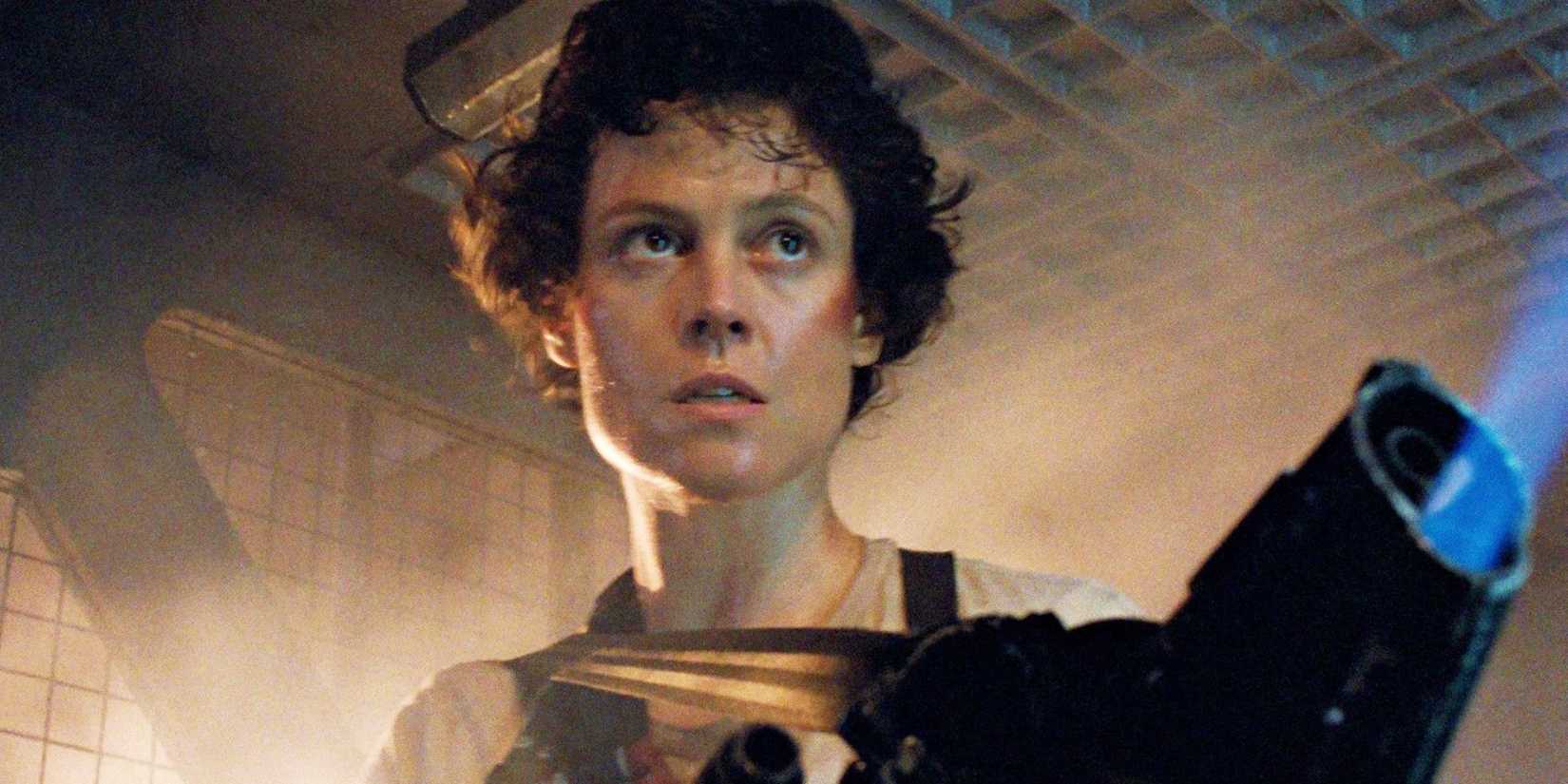 Sigourney Weaver as Ellen Ripley in Aliens (1986), moving down a corridor with a flamethrower