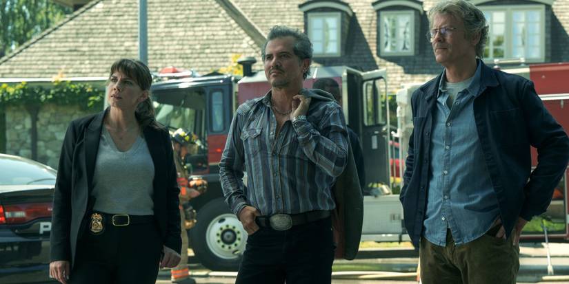 Anna Chlumsky, John Leguizamo, and Greg Kinnear standing on a strett in Smoke