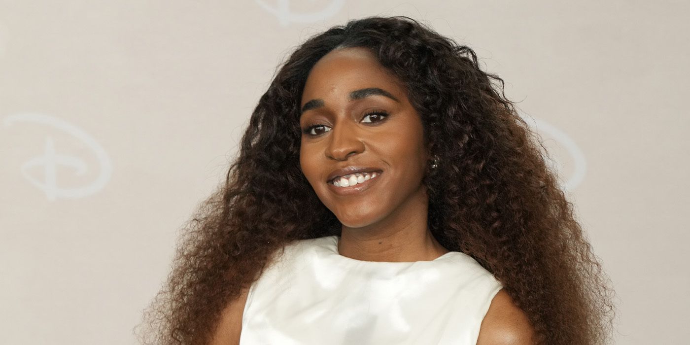 Ayo Edebiri smiling on the red carpet 