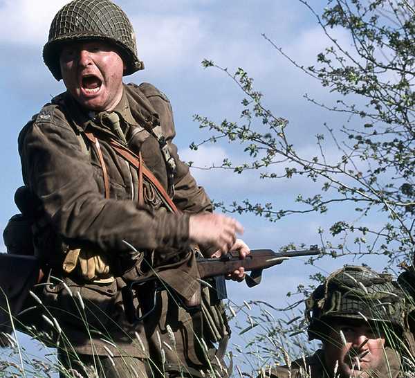 Soldiers yelling in a field in Band of Brothers.
