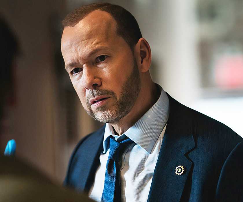 Donnie Wahlberg wears a blue suit as Danny Reagan in Blue Bloods