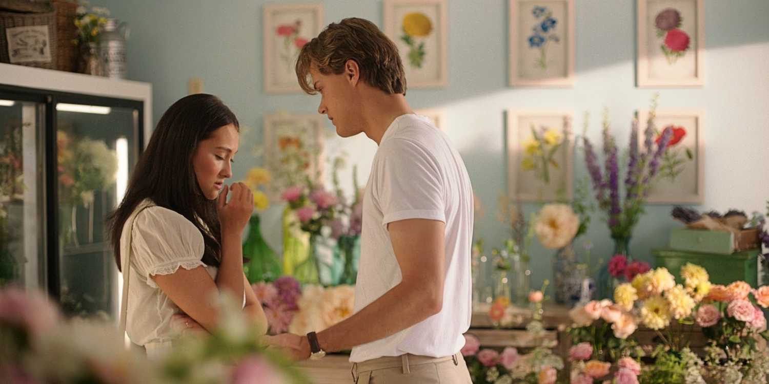 Belly Conklin and Conrad Fisher standing together in a flower shop in The Summer I Turned Pretty TSITP Season 3