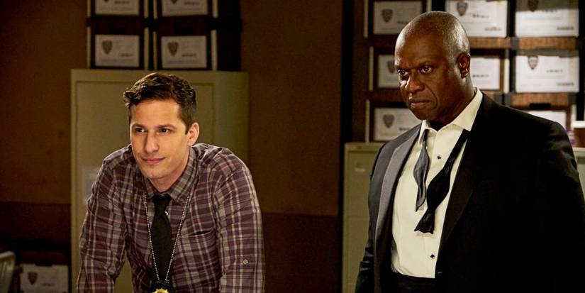 Jake Peralta and Captain Raymond Holt standing next to each other in 'Brooklyn Nine-Nine.'