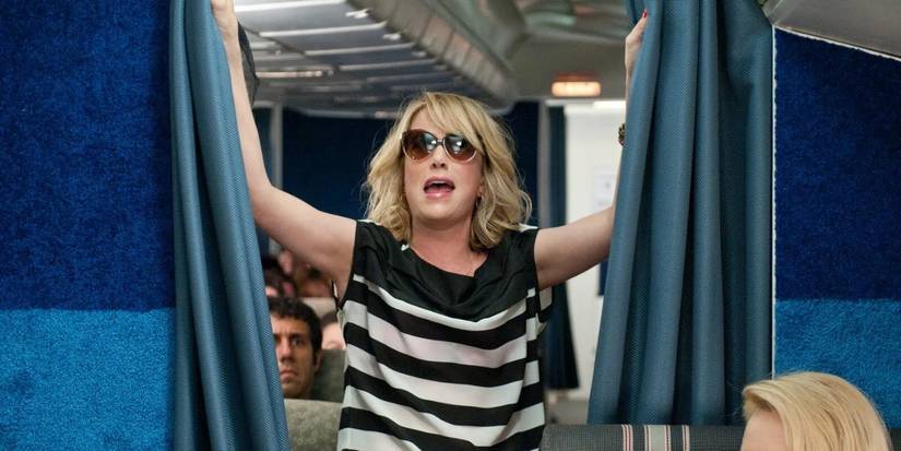 Annie walking into the First Class section of a plane in Bridesmaids