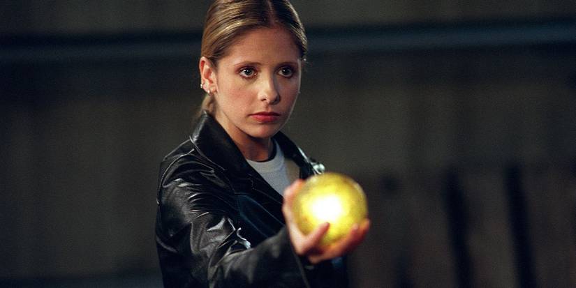 Sarah Michelle Gellar offering a golden orb in Buffy the Vampire Slayer.