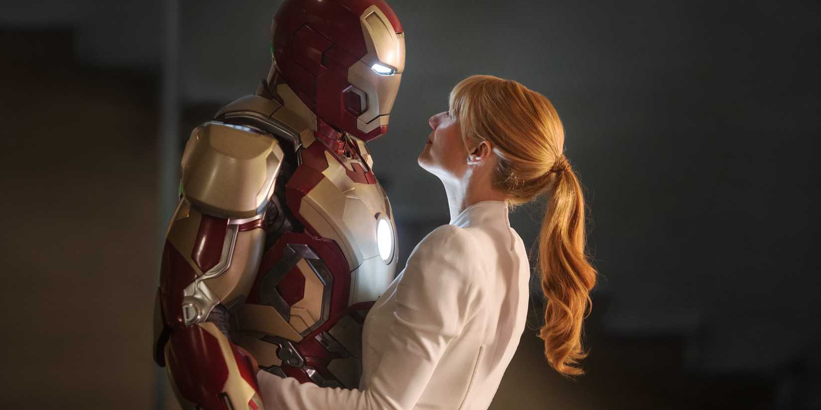 Pepper Potts holds Tony Stark in the Iron Man suit in Iron Man 3.