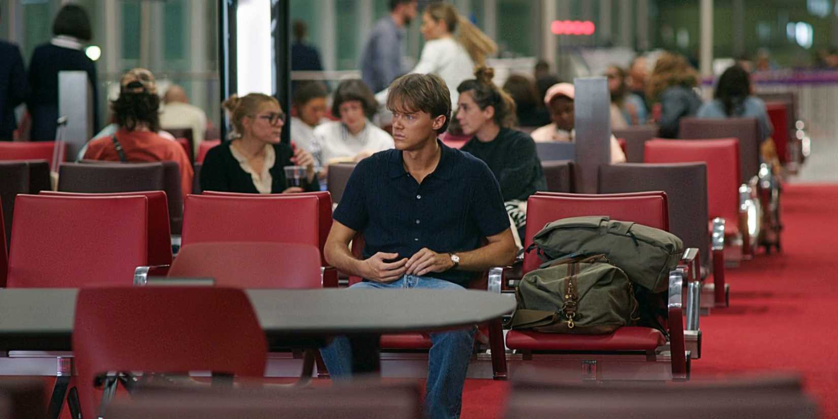 Conrad Fisher sitting at the airport in The Summer I Turned Pretty TSITP Season 3