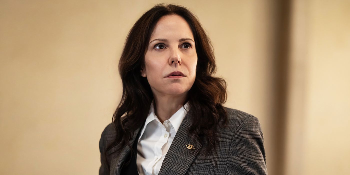 Mary-Louise Parker as Ms. Sigsby dressed in a suit and looking off to the left in The Institute