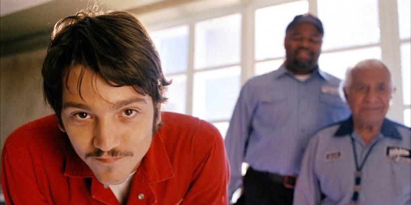 Diego Luna leaning toward the screen and smiling in The Terminal