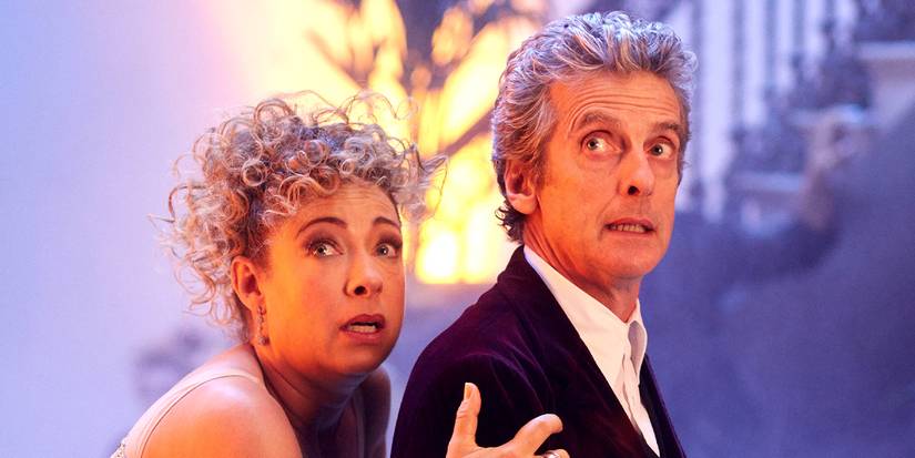 Alex Kingston stands behind Peter Capaldi and looks worried in Doctor Who.