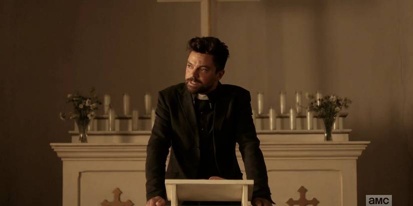 Dominic Cooper standing at the podium in a church giving a speech in the Preacher pilot episode.