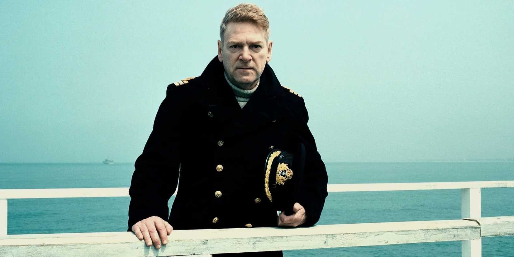 Dunkirk (2017) - Kenneth Branagh, in uniform, looks on from a pier in Dunkirk