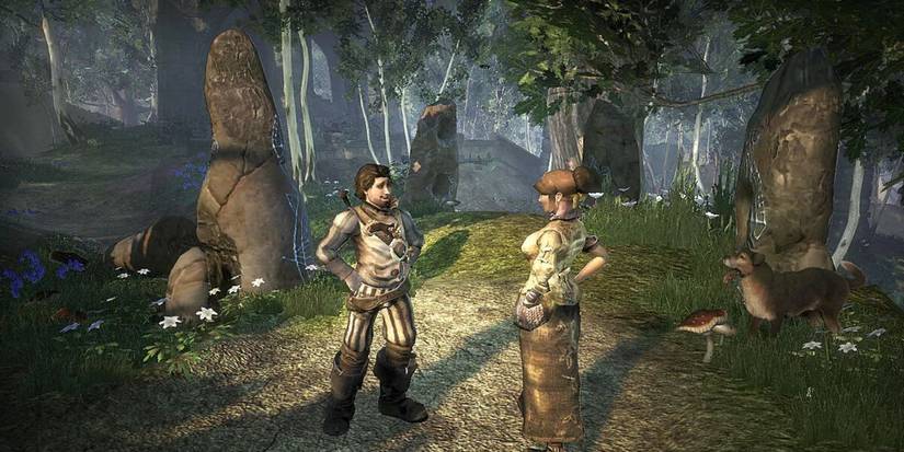 Two characters standing in a forest in Fable 2