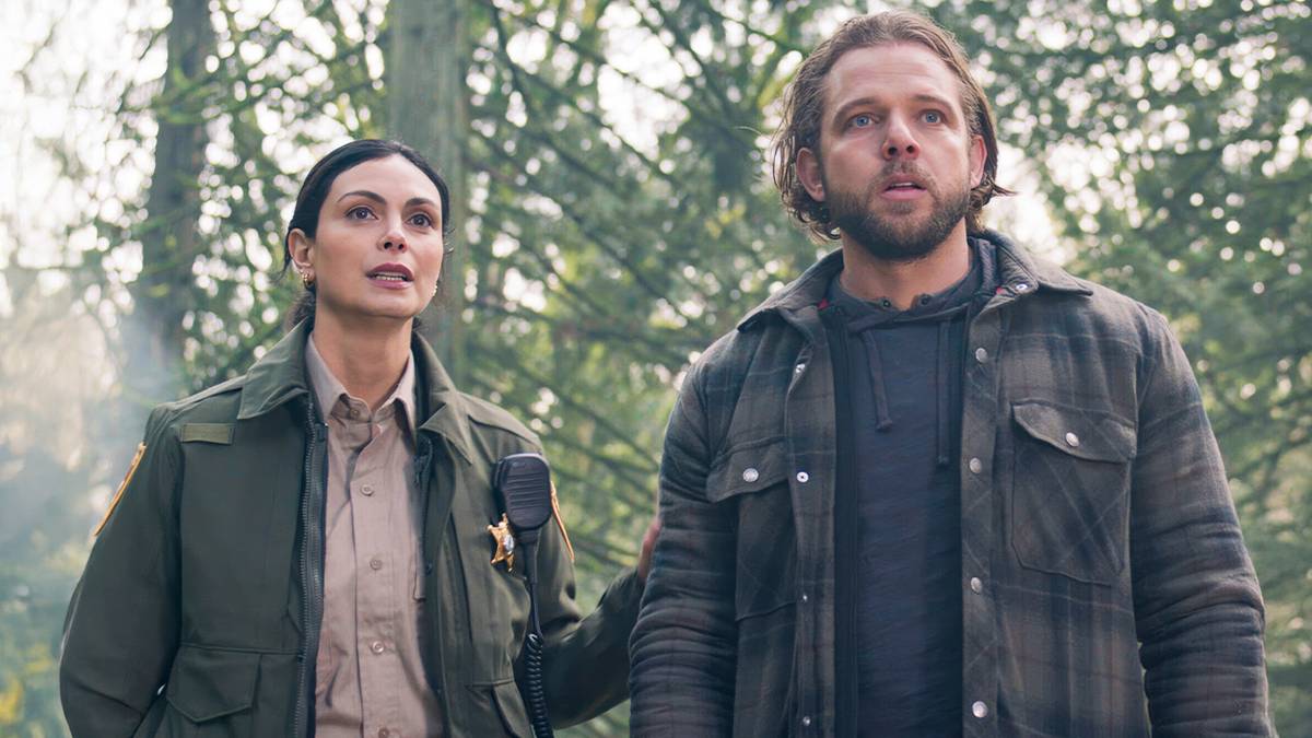 Fire Country - Morena Baccarin & Max Thieriot look shocked in the woods