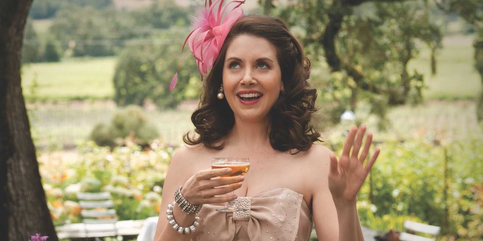 Alison Brie as Suzie holding a cup of wine and looking emotional in The Five-Year Engagement.