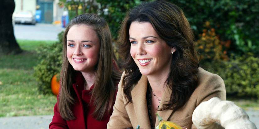 Rory and Lorelai smiling next to each other in Gilmore Girls.