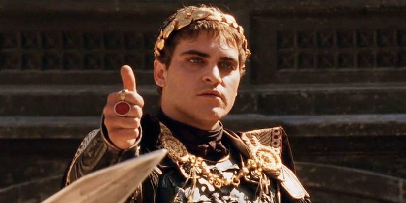 Joaquin Phoenix as Commodus in Gladiator (2000), giving a thumbs up during some gladiatorial games