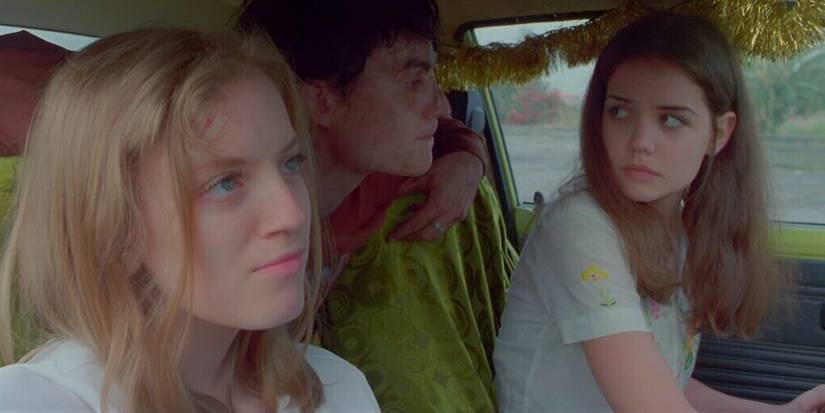 Sarah Polley, Nathan Bexton, and Katie holmes sitting in a car at the end of Go (1999)