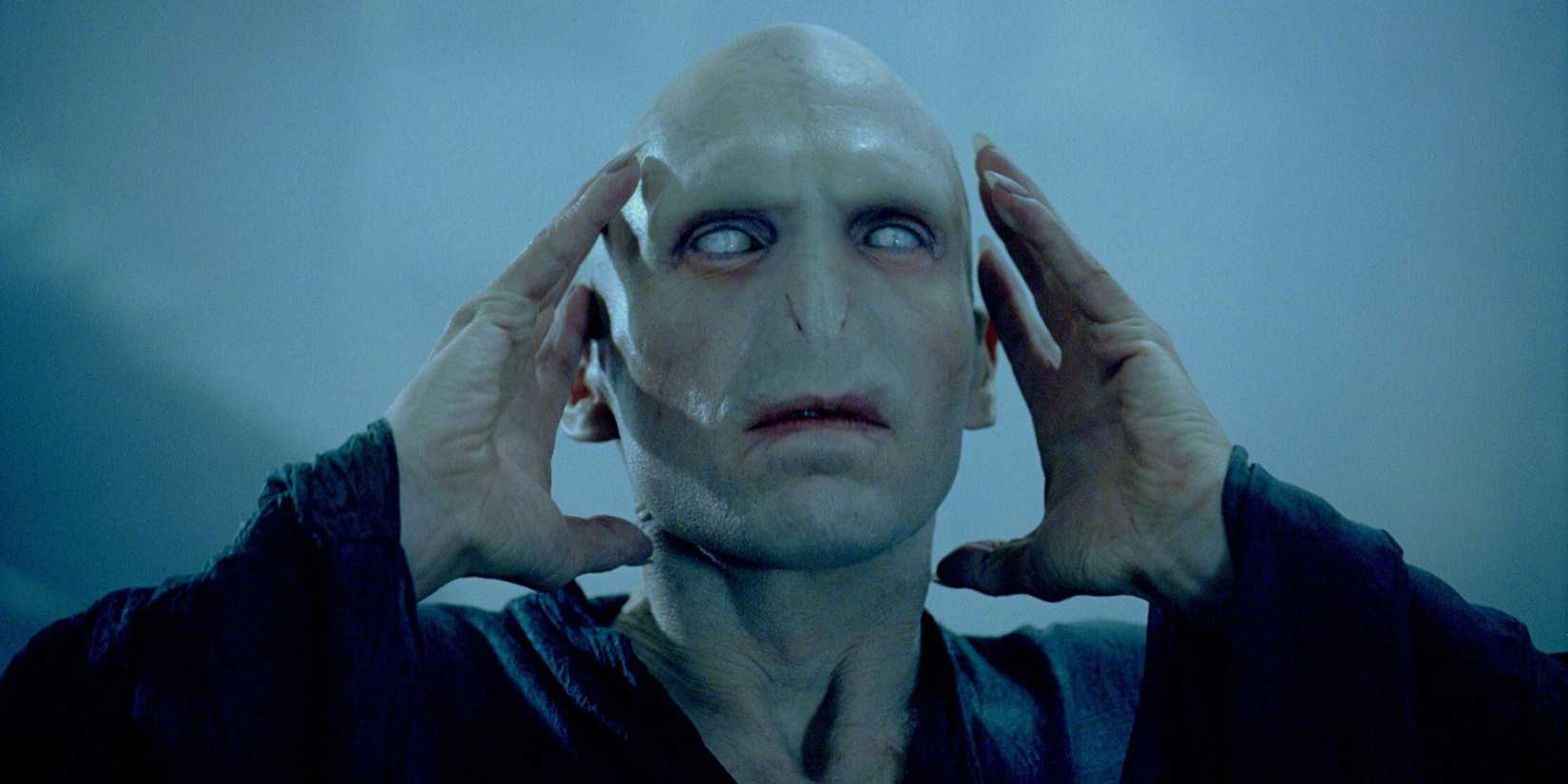 Ralph Fiennes as Voldemort with his hands up near his head in Harry Potter and the Goblet of Fire.