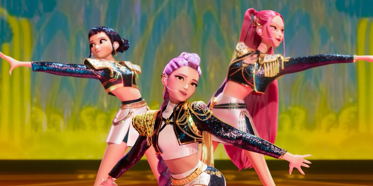 Three pop stars with matching outfits perform on stage with choreography in KPop Demon Hunters.