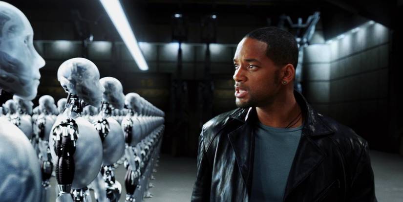 Will Smith as Detective Spooner investigating a warehouse full of humanoid robots in I, Robot.