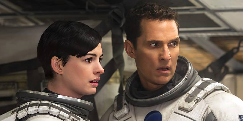 Matthew McConaughey's Cooper and Anne Hathaway's Brand look worried in spacesuits in Interstellar.