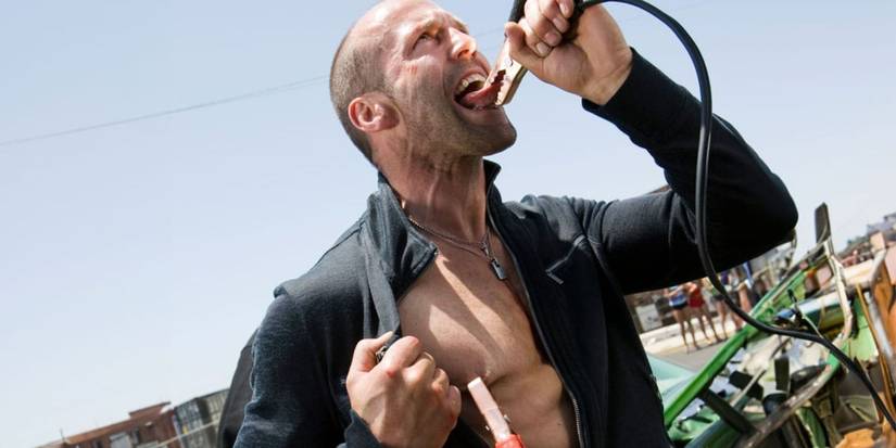 Jason Statham with jumper cables on his tongue and nipple in Crank