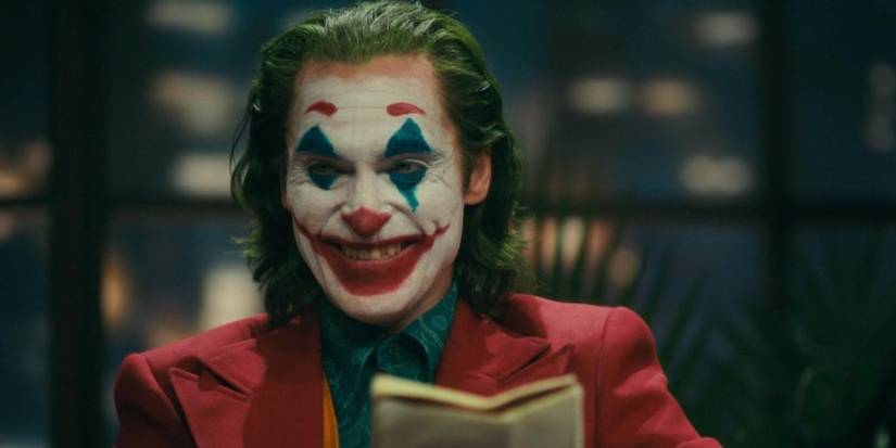 Joaquin Phoenix in Joker laughing in a talk show