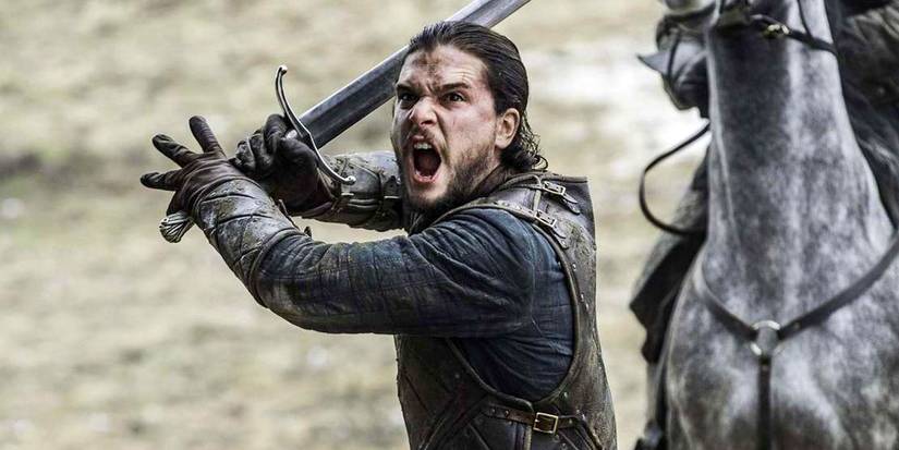 Kit Harington as Jon Snow yelling while wielding a sword in Game of Thrones.