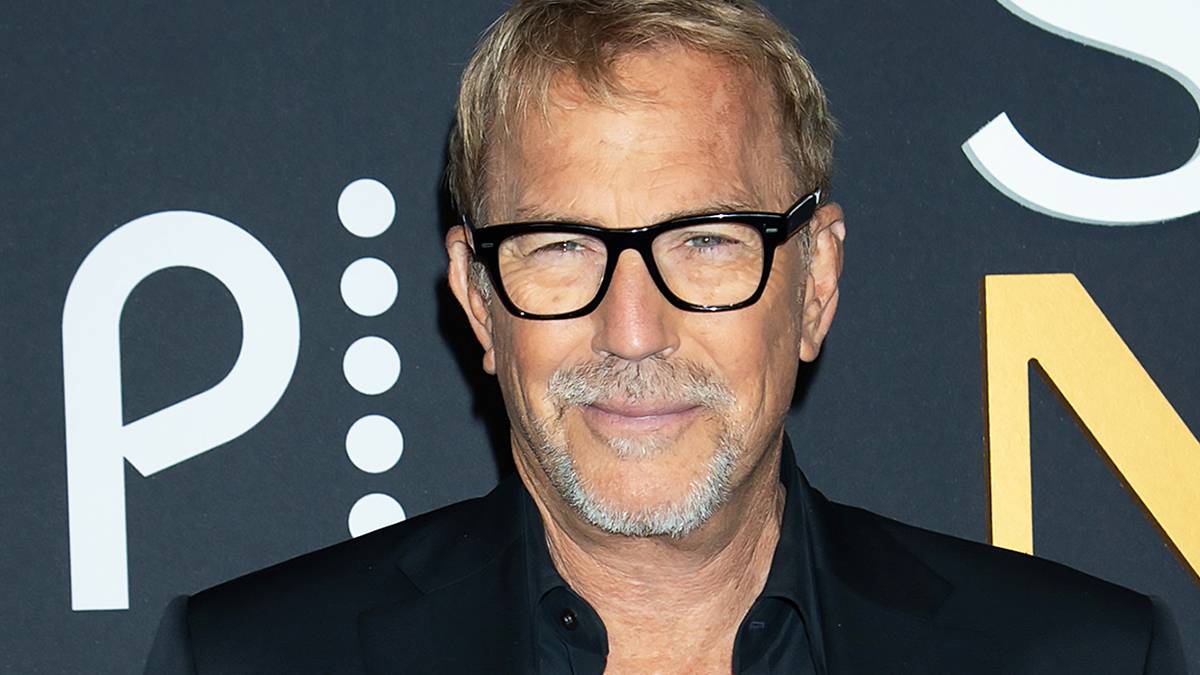 Kevin Costner wears glasses on the red carpet