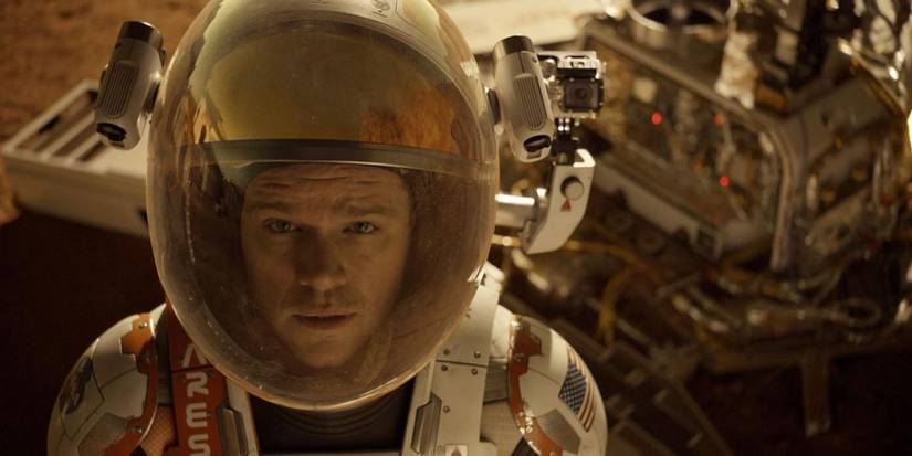 Matt Damon in his spacesuit looking into camera in The Martian