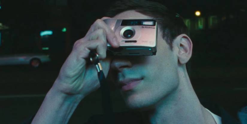 Matthew (Théodore Pellerin) taking a photo in 'Lurker'