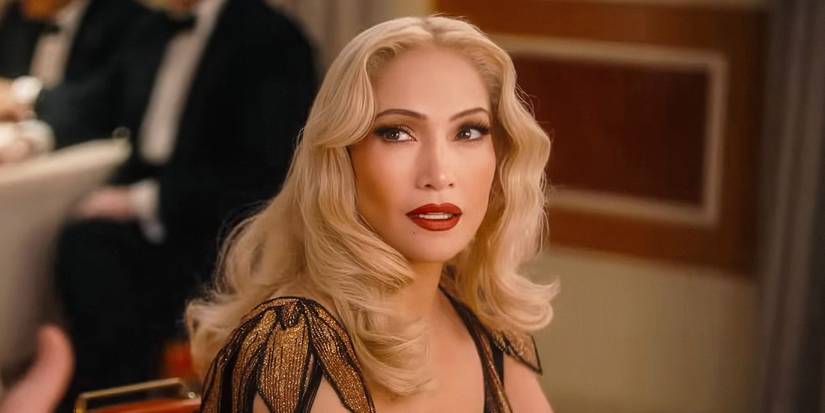Jennifer Lopez looking up from a restaurant table in Kiss of the Spider-Woman