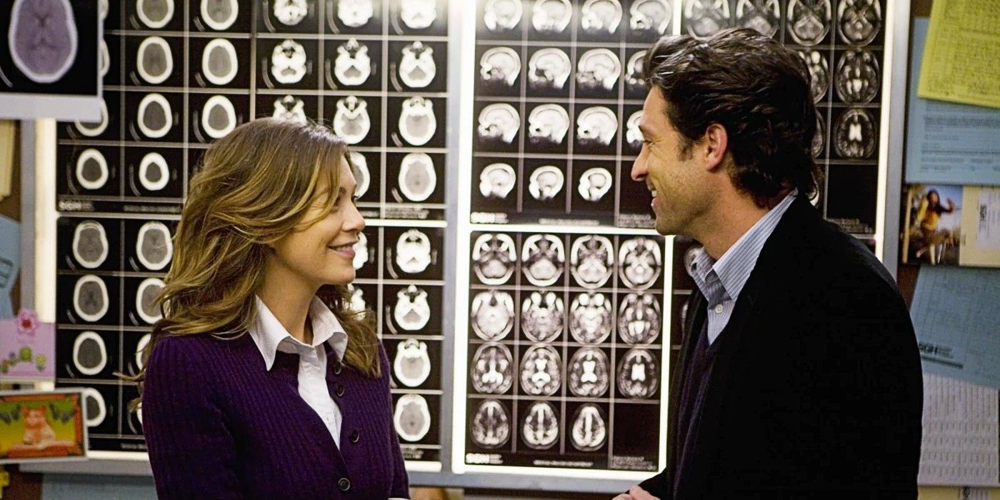 Derek Shepherd proposing to Meredith Grey in front of a wall full of brain scans in Grey's Anatomy Season 5.