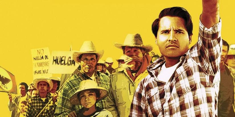 Michael Pena as Cesar Chavez raising his arm in front of some workers on the poster for Cesar Chavez