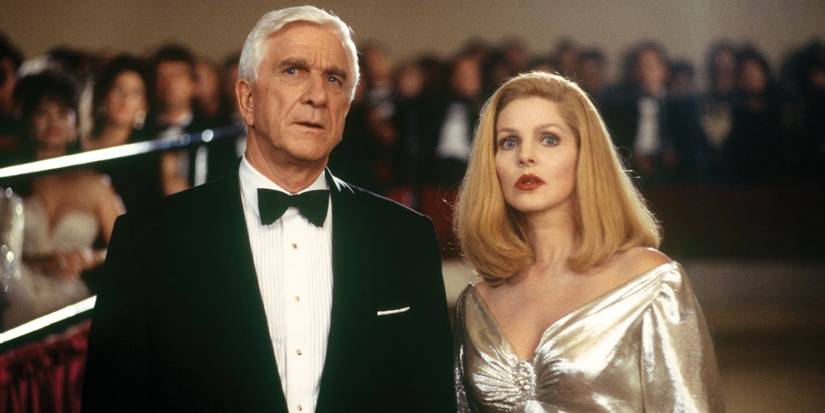 Leslie Nielsen as Lieutenant Frank Drebin and Priscilla Presley as Jane Spencer-Drebin at the Oscars in Naked Gun 33⅓_ The Final Insult (1994)