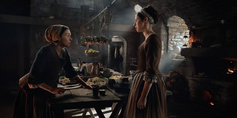 Hermione Corfield and Sara Vickers talking in a kitchen in Outlander: Blood of My Blood Episode 3.