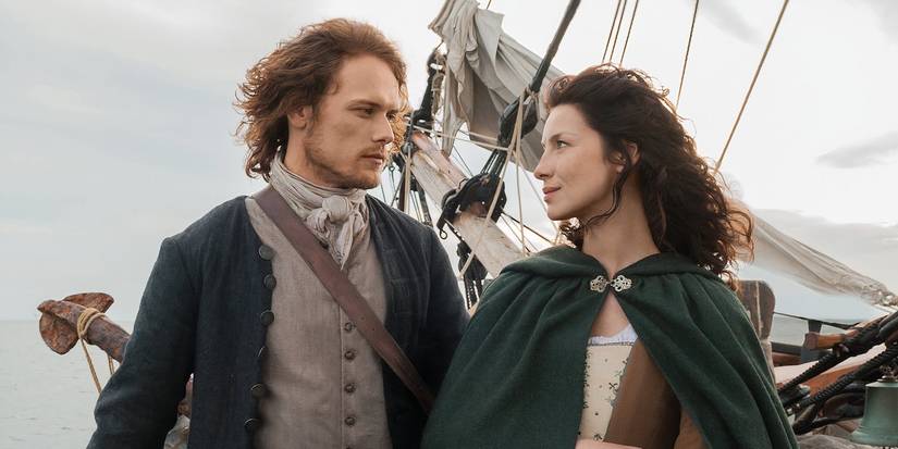Outlander Sam Heughan and Caitríona staring at each other with love.