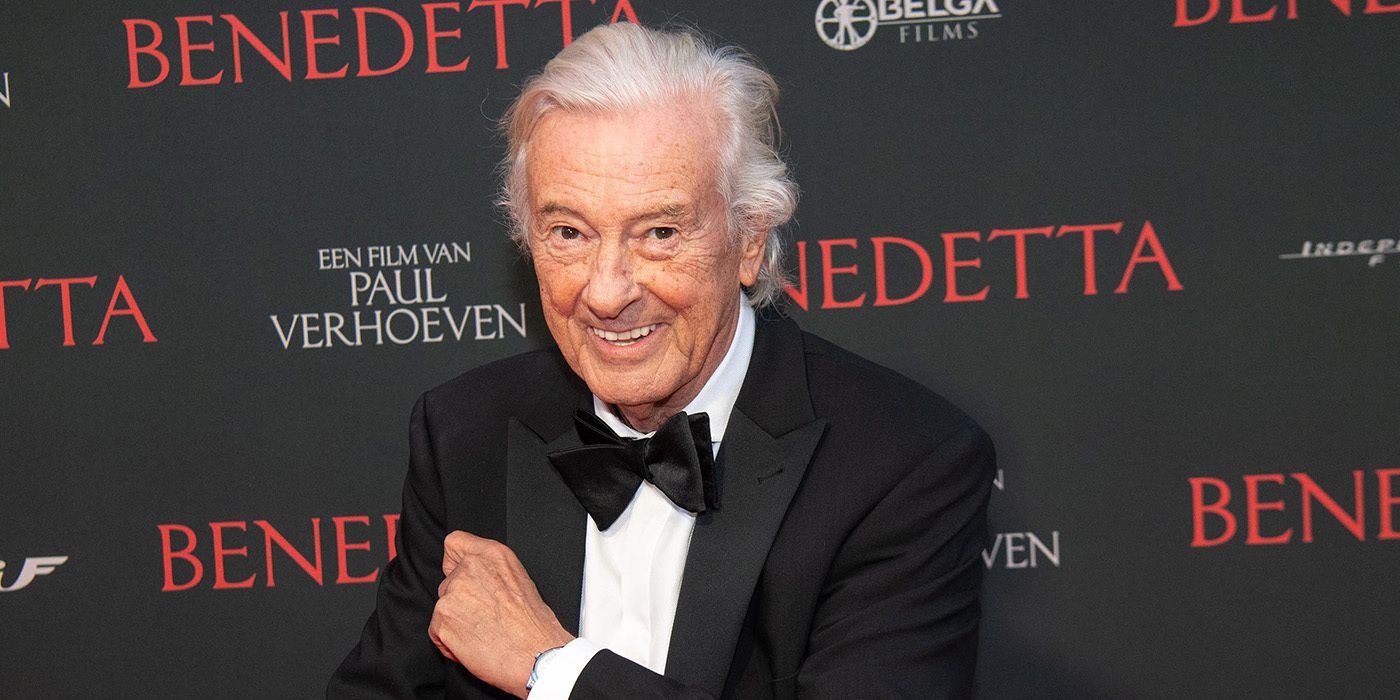 Paul Verhoeven smiling on the red carpet for Benedetta