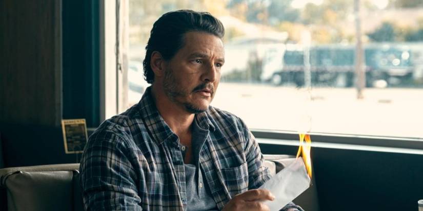 Pedro Pascal burning a paper in a diner booth in Freaky Tales